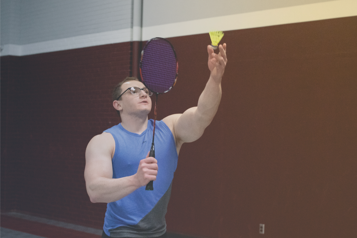 individual serving in a badminton match