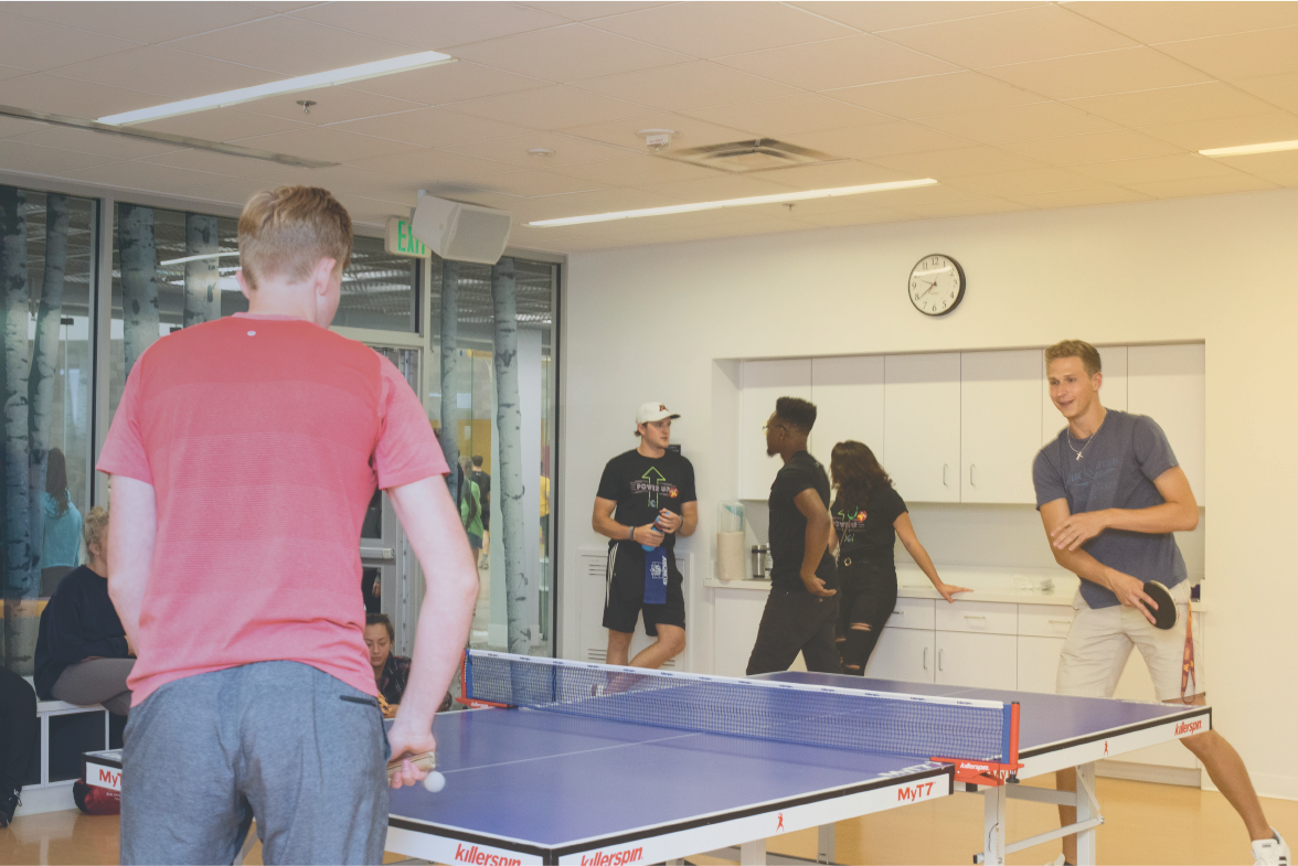 group of students playing table tennis