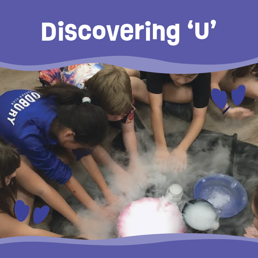 campers putting hands through smoke while doing science experiment
