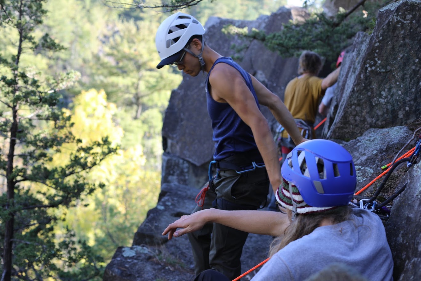 image of two people talking before their climb