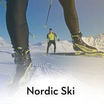 two individuals Nordic skiing 
