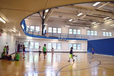 St. Paul Gym Gymnasium with people playing basketball